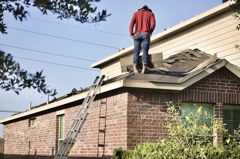 Professional roofer working on a residential roof in Land O' Lakes